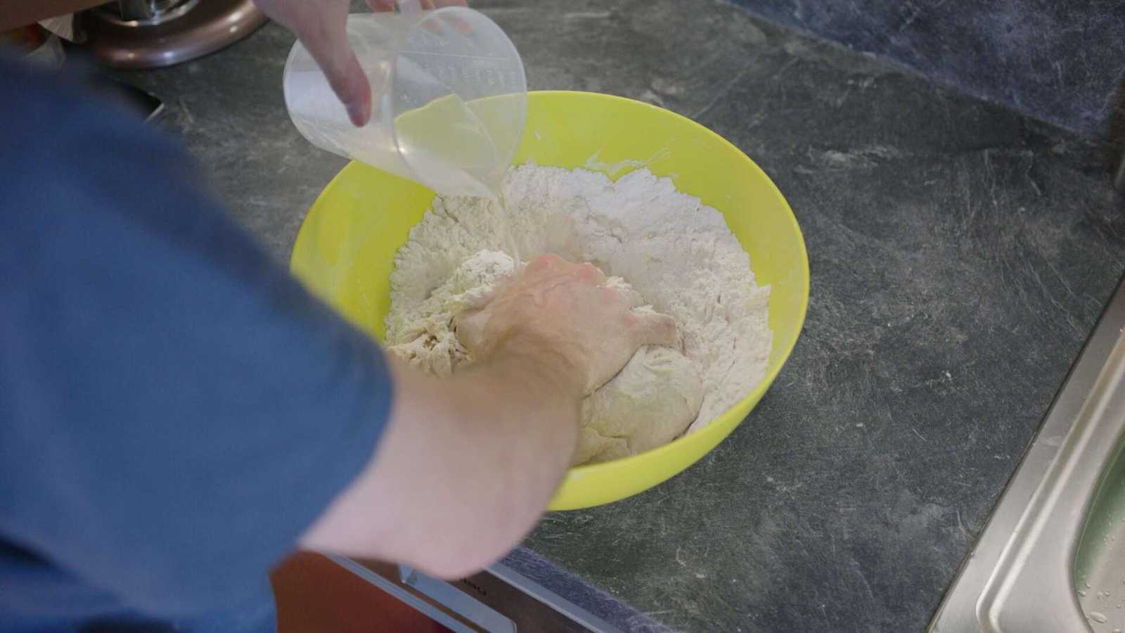 Watter getting added to dough