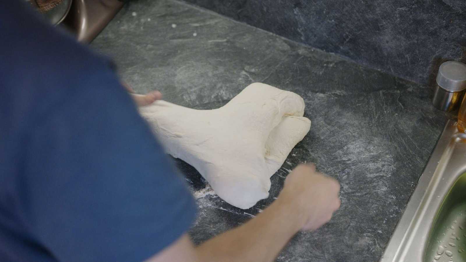 Dough being folded in the middle