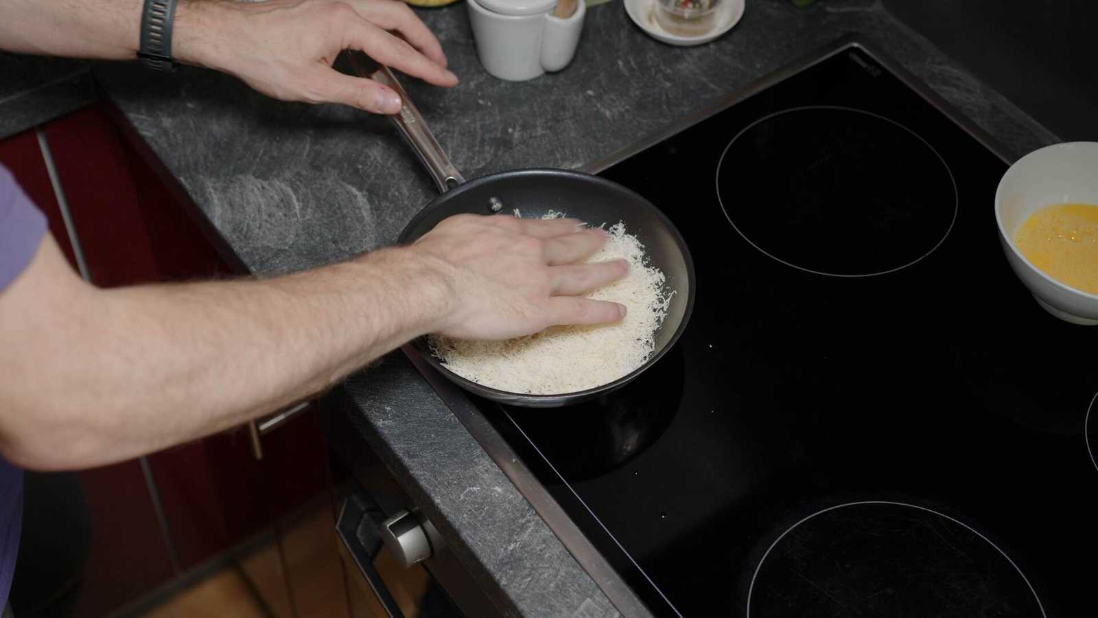 Parmesan being spread by hand