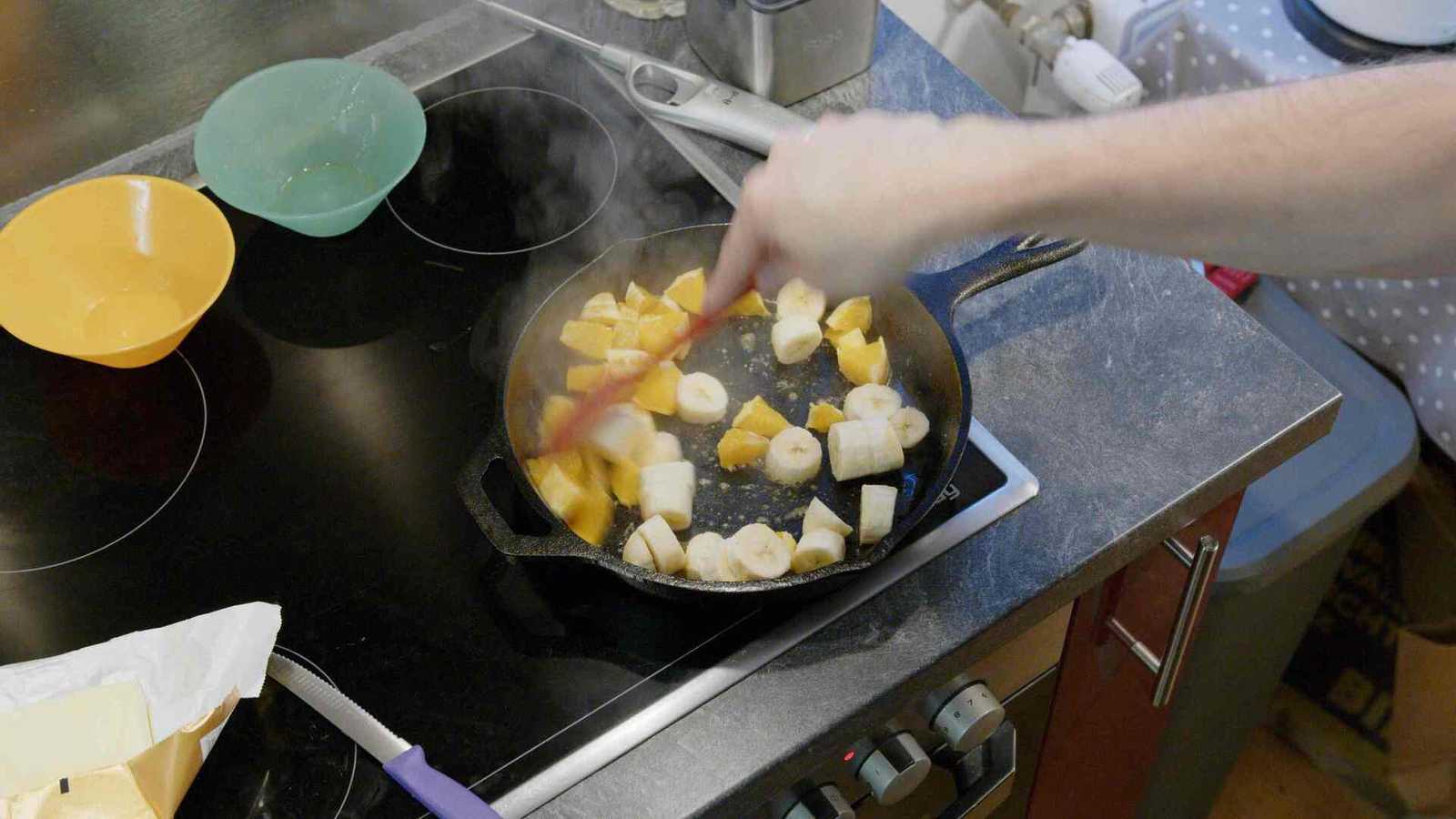 Mixing fruits with honey butter mixture